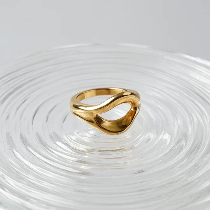 Sculptural gold ring on rippled glass — generated with Krea 2 Large